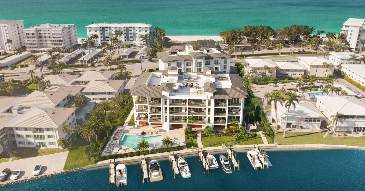 Aerial view of luxury waterfront condominiums with private docks near the Gulf of Mexico in Naples