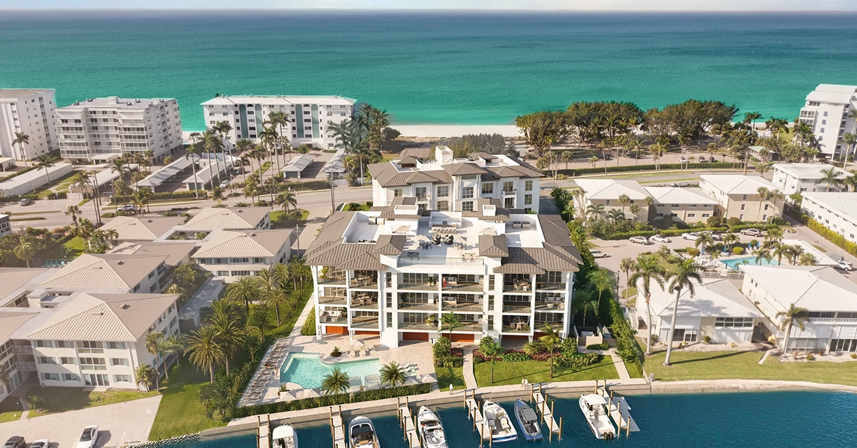 Aerial view of luxury waterfront condominiums with private docks near the Gulf of Mexico in Naples