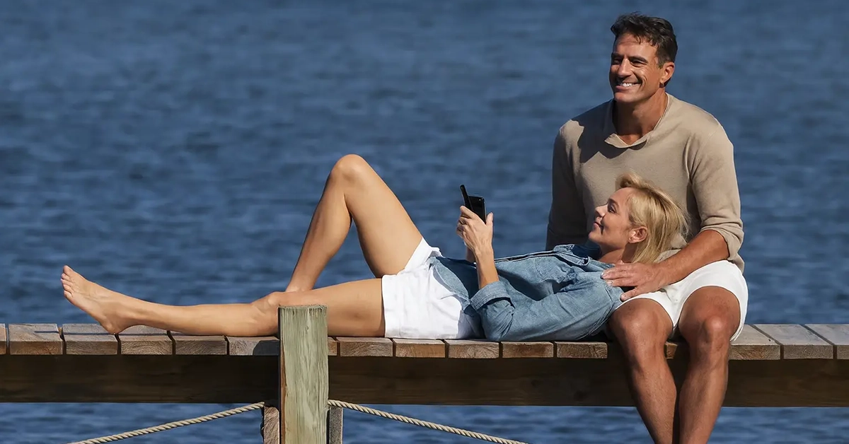 Couple relaxing on a dock overlooking the water in Naples Florida