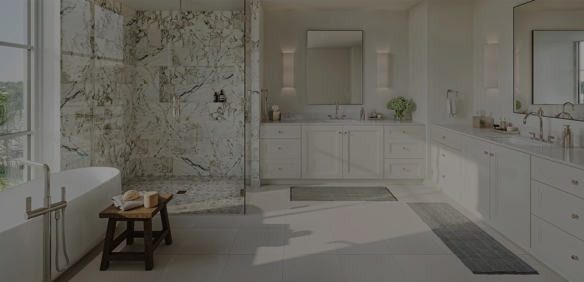 Primary bathroom with marble shower, freestanding tub, and double vanity