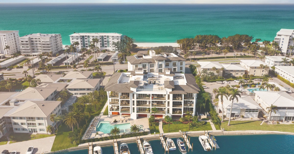 Aerial view of 2020 Gulf Shore Naples waterfront condominium and marina
