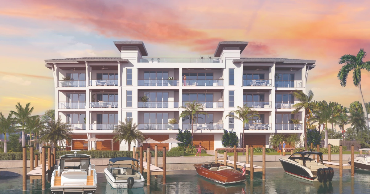 Waterfront condo with private docks and boats at sunset under colorful sky.